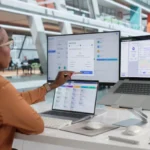 Woman Uses Laptop To Review Payroll System