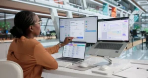 Woman Uses Laptop To Review Payroll System