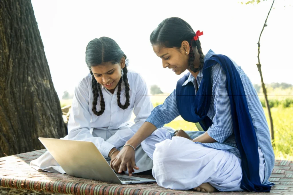School girls using laptop