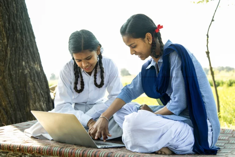 School girls using laptop